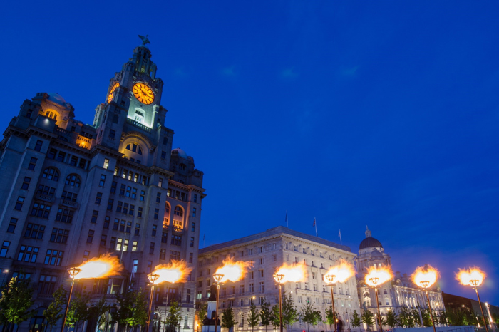 jubilee beacons lit up in front of the three graces at night