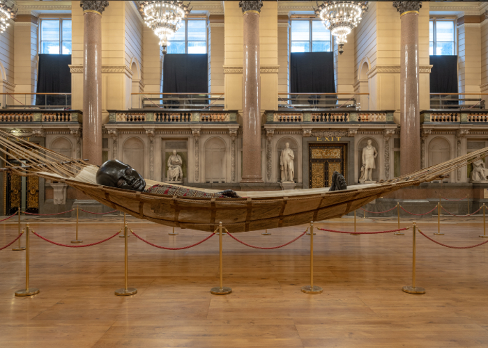 Little Boy Giant asleep in a hammock inside St George's Hall