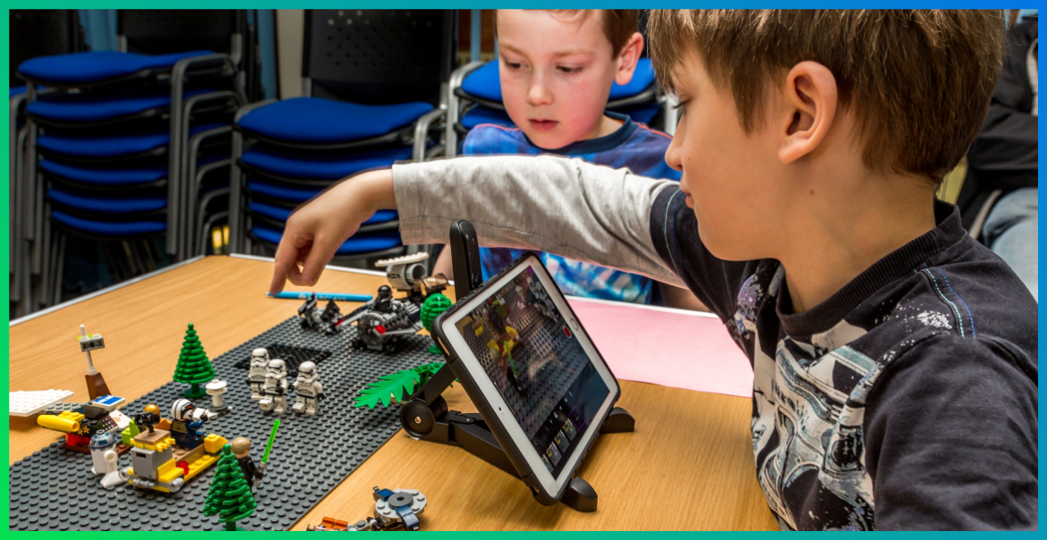 two boys making creations with lego