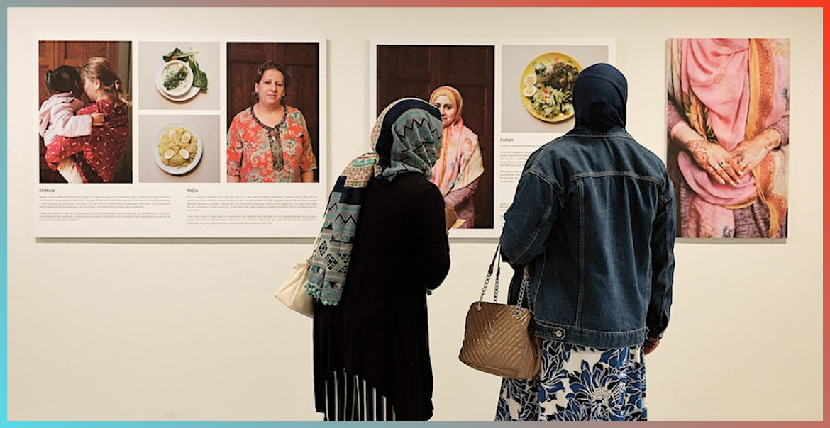 Two people looking at an exhibtion.