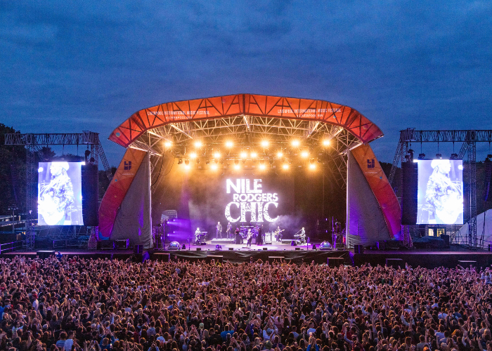 picture of Nile Rogers performing on stage in Sefton Park as part of LIMF 2019