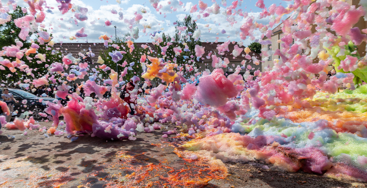 A vibrant formation of rainbow foam, creating a whimsical and colourful spectacle