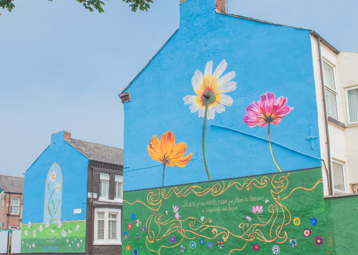 end gable of a terrace house in Liverpool painted with colourful flowers