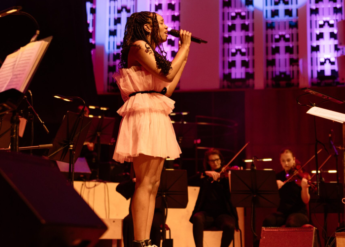 music artist Hannah Morgan singing with a live orchestra at the Liverpool Philharmonic