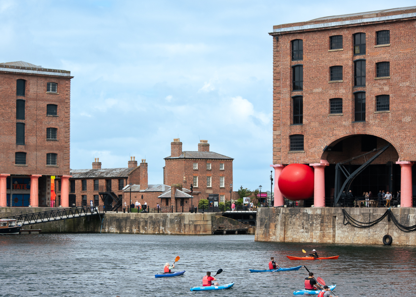 big red ball within the colonnades of Royal Albert Dock Liverpool