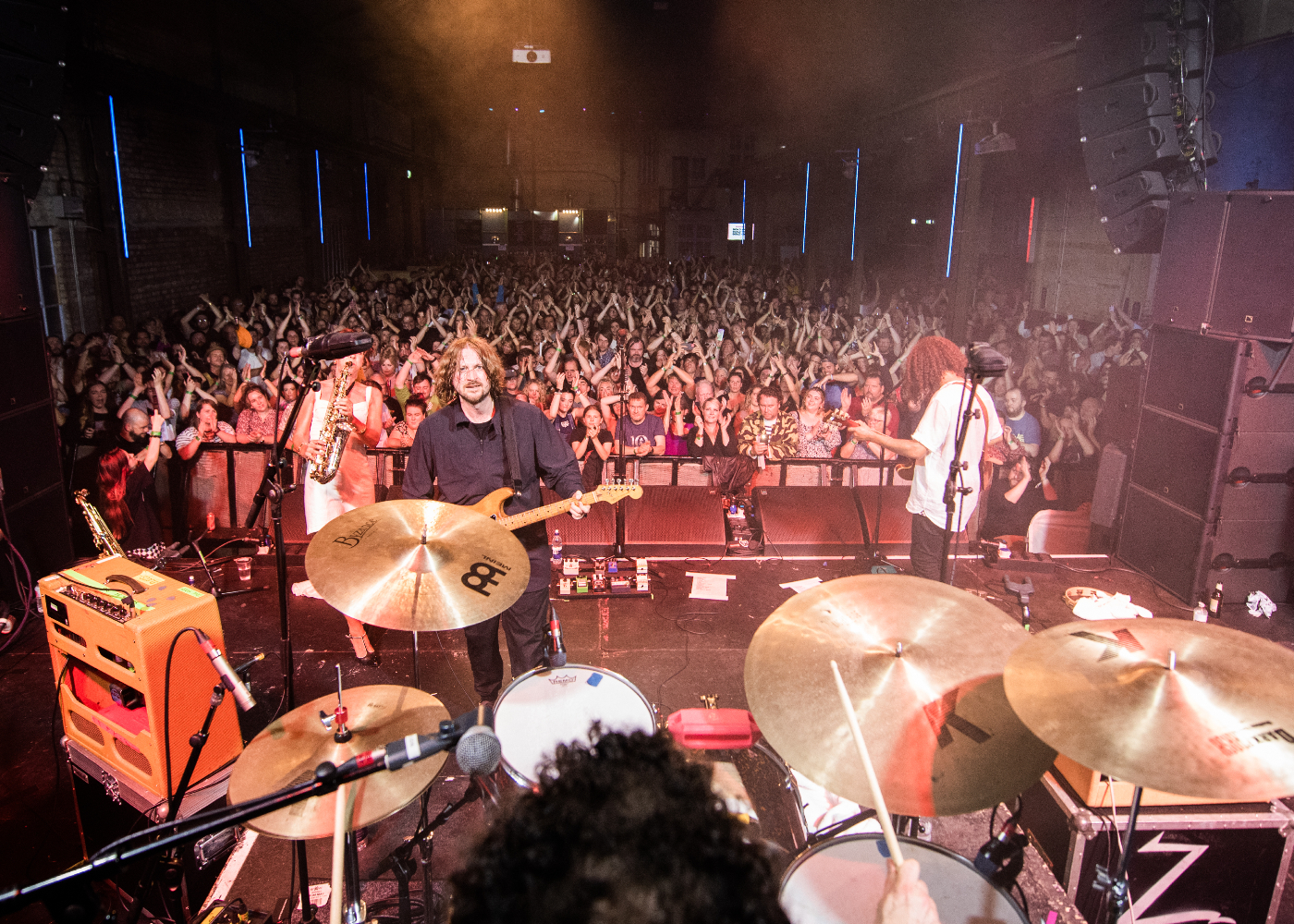 Zutons playing on stage at Camp & Furnace in front of a large crowd