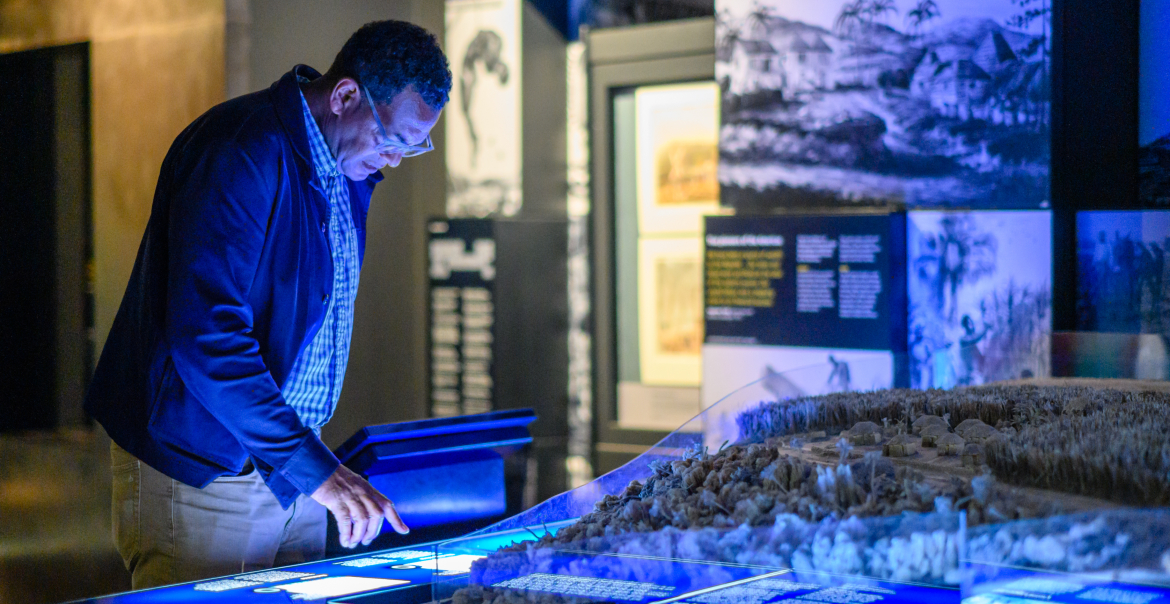 A person looking at a display in a museum.