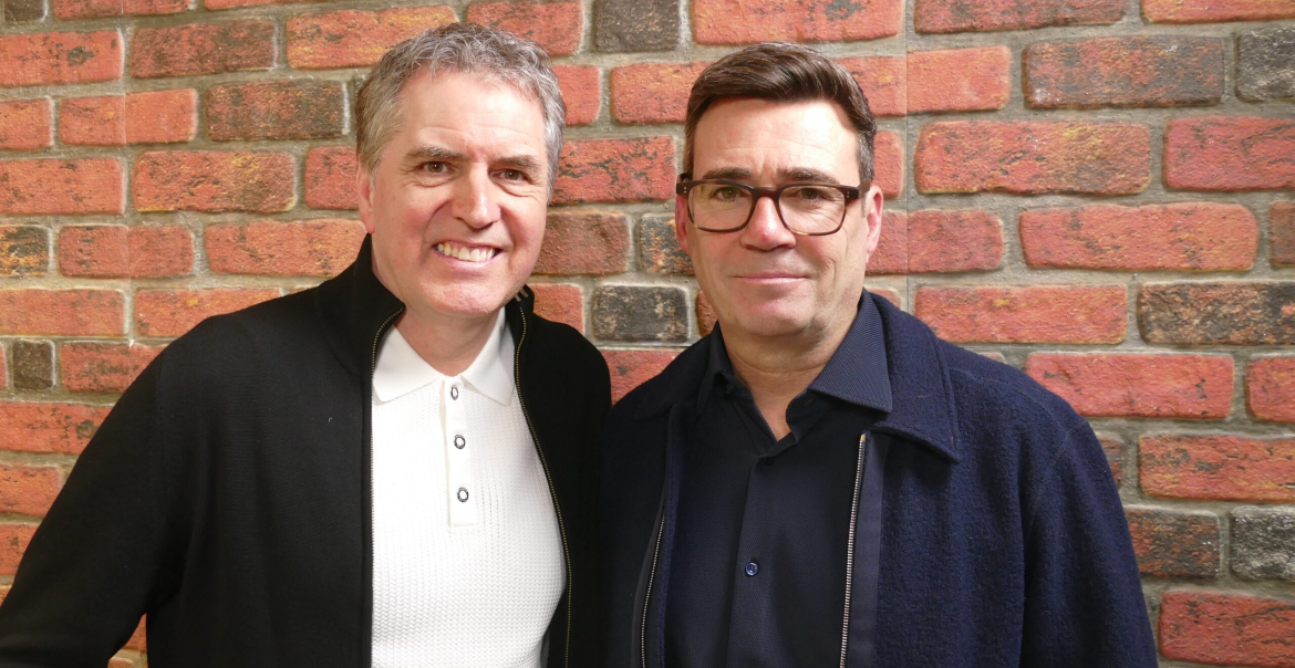 An image of Andy Burnham & Steve Rotheram standing together in front of an exposed brick wall