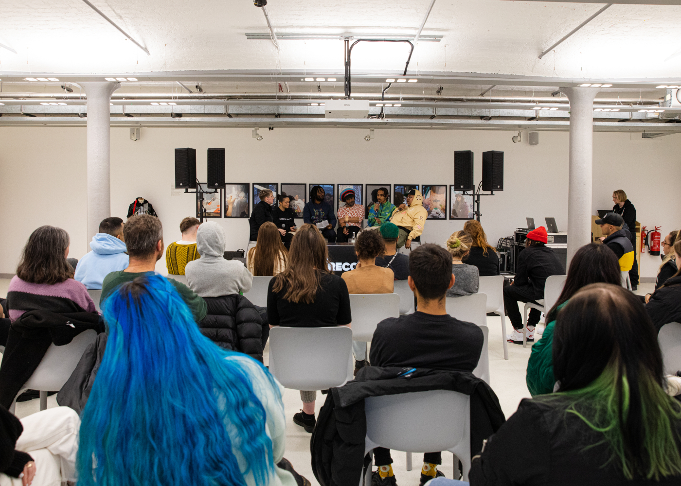 group of people enjoying listening to a panel as part of ON RECORD