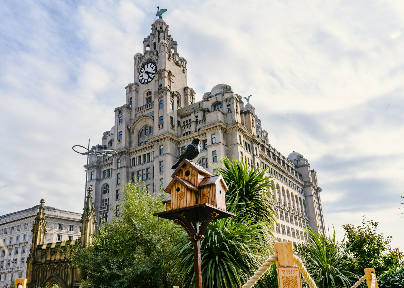 image of These Birds Can Sing bird art installation located in St Nicholas Parish Church garden over looked by the Royal Liver Building